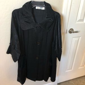 Really sleek, shiny shirt with 2 pockets